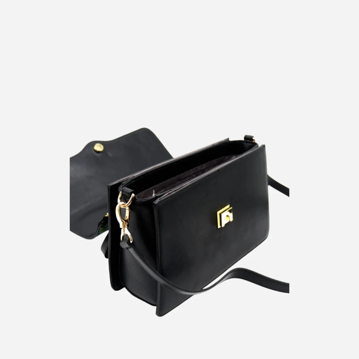 Black handbag with gold accents on a light gray background