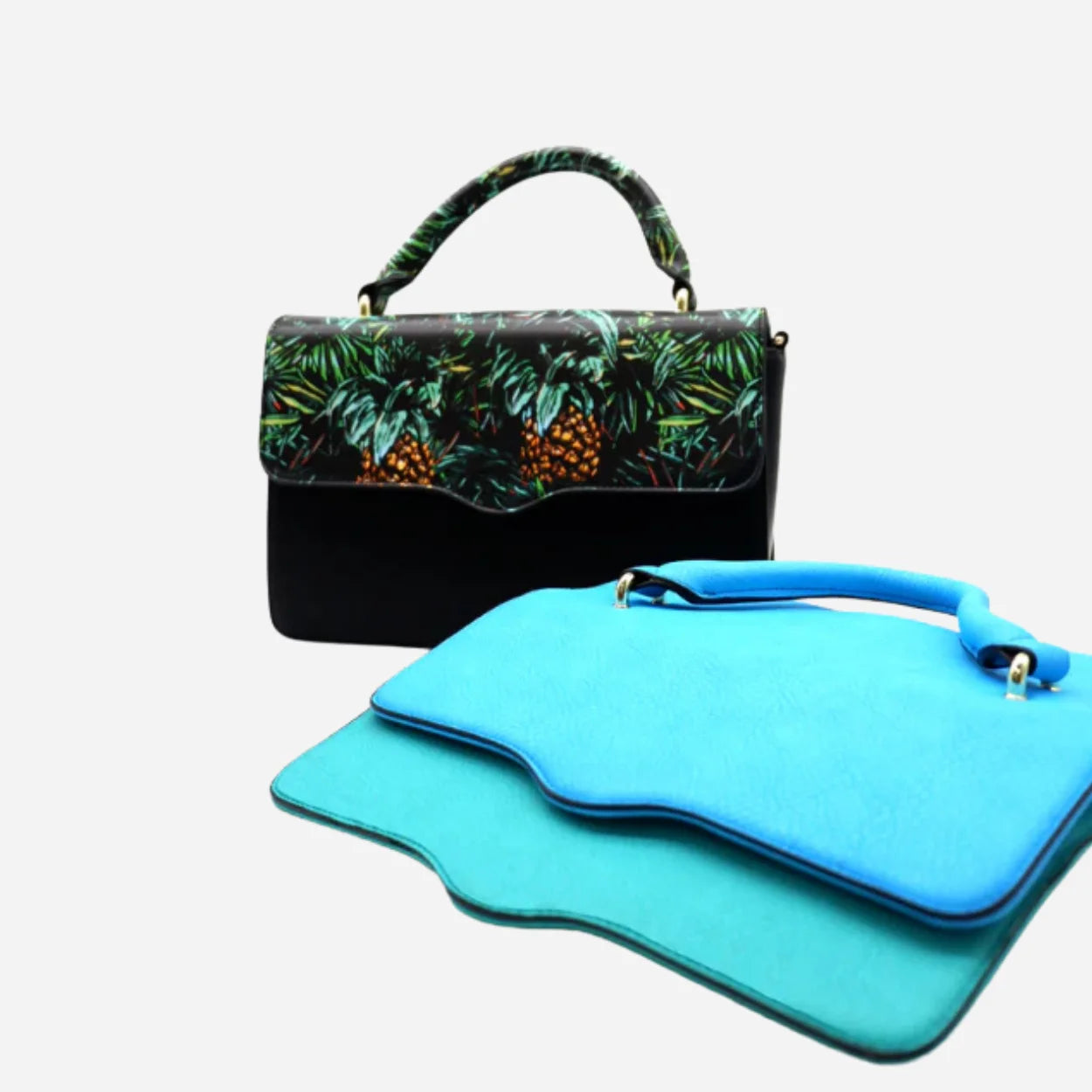 Black handbag with green leaf pattern and blue pouches on a white background