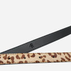 Maggie Leopard print belt with a black strap on a light gray background