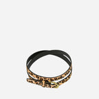 Leopard print belt with a gold buckle on a white background